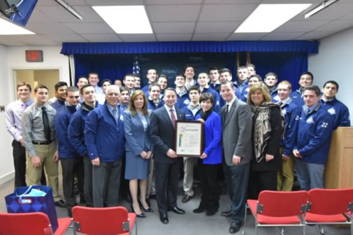 Westcheser County Executive Rob Astorino, center, congratuates his alma mater, Westlake High School in Mount Pleasant, for winning the football championship this fall. He is shown with members of the Wildcats football team.