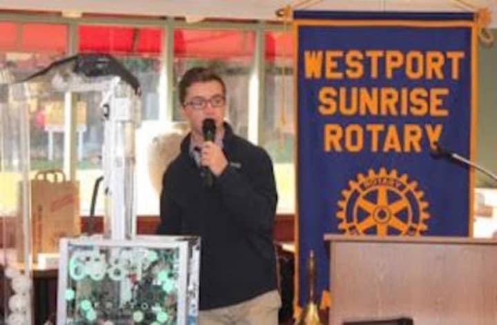 Staples High senior Peter Sauer is the student of the month for the Westport Sunrise Rotary. He shows off Kratos, star of his robotics team.