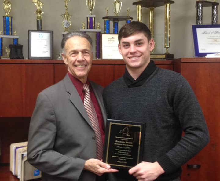 Zach Evens is shown with Director of Health, Physical Education and Athletics, Stewart Hanson at Harrison High School.