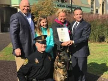 Mayor Ganim along with the Hickey family and new K-9 Dennis and his handler.