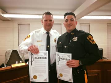 Lieutenant Thomas Ryan and Officer James Divite were honored with proclamations for their work in subduing an emotionally disturbed man.
