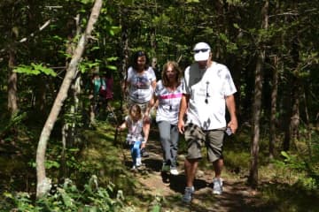 Hikers stroll through the woods during a previous Hike Against Addiction in Ringwood. 