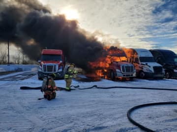 Pounds of bleach and vegetables burned four tractor-trailers caught on fire at an area truck stop.