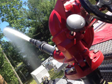 A dry hydrant being tested by firefighters.