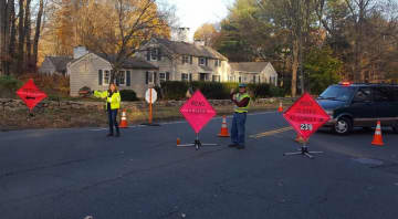Wilton CERT is helping with traffic control at the scene of a water main break on Westport Road in Wilton on Tuesday.