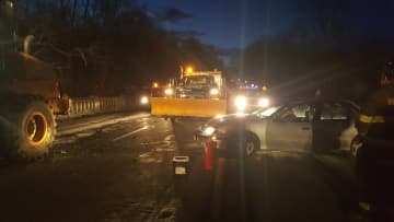 A state DOT worker clearing snow off Route 9G was injured when a his front-end loader was hit by a car.