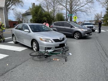 A bicyclist was hospitalized in Western Massachusetts after being struck by a car in a roadway.