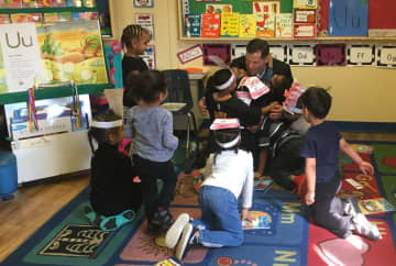 County Executive Marc Molinaro reads to children at the Catharine Street Community Center in Poughkeepsie.