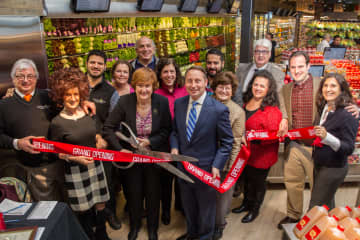 Westchester County Executive Robert P. Astorino and Larchmont Mayor Anne McAndrews cut the ribbon at the grand opening of the new DeCicco & Sons supermarket in Larchmont on Friday, Dec. 18.