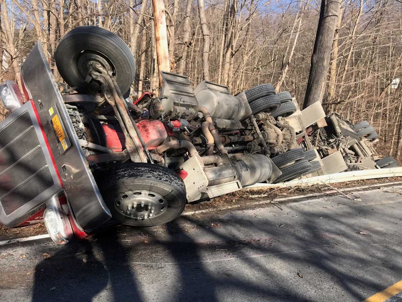 A rollover crash of a tractor-trailer carrying a large amount of fuel has closed Route 116.