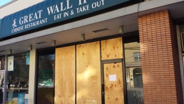 Great Wall II Chinese Restaurant on East Boston Post Road in Mamaroneck remained boarded up on Tuesday after a fire destroyed its interior on Monday morning, closing down Route 1 through the village.