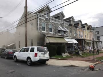 Reading firefighters rescued a woman from a smoke-filled house Friday morning.