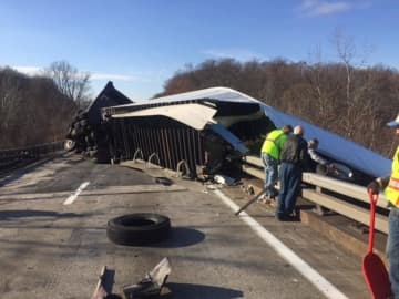 One lane of I-84 remains closed following a tractor-trailer crash.