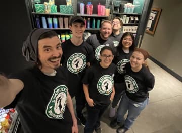 A group of Danbury Starbucks employees with their union shirts.