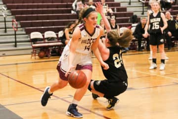 Bethel's Lily Daniels drives on a defender in a game earlier this year. Daniels scored 14 points Monday to lead the Wildcats past Newtown in the SWC girls basketball semifinals.