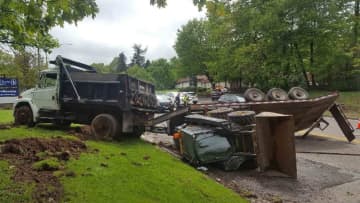 A dump truck driver lost control of his vehicle and ended up closing a roadway for more than three hours.
