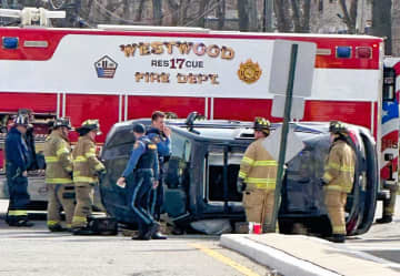 Firefighters extricated the driver following the rollover in front of the hospital on Old Hook Road in Westwood.