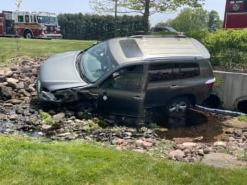 A vehicle veered off of Frazer Fir Road and crashed into a brook in South Windsor on Tuesday, May 16.