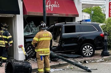 The SUV also toppled a light pole, snapped a small tree and knocked two garbage cans onto Main Street in Ramsey on Saturday, May 13.
