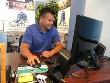 Retired Hackensack police officer Alex Ferenczi opened Blueline Realty Group on Hudson Street in 2017. Nearly a dozen of his 30 associates work in law enforcement.