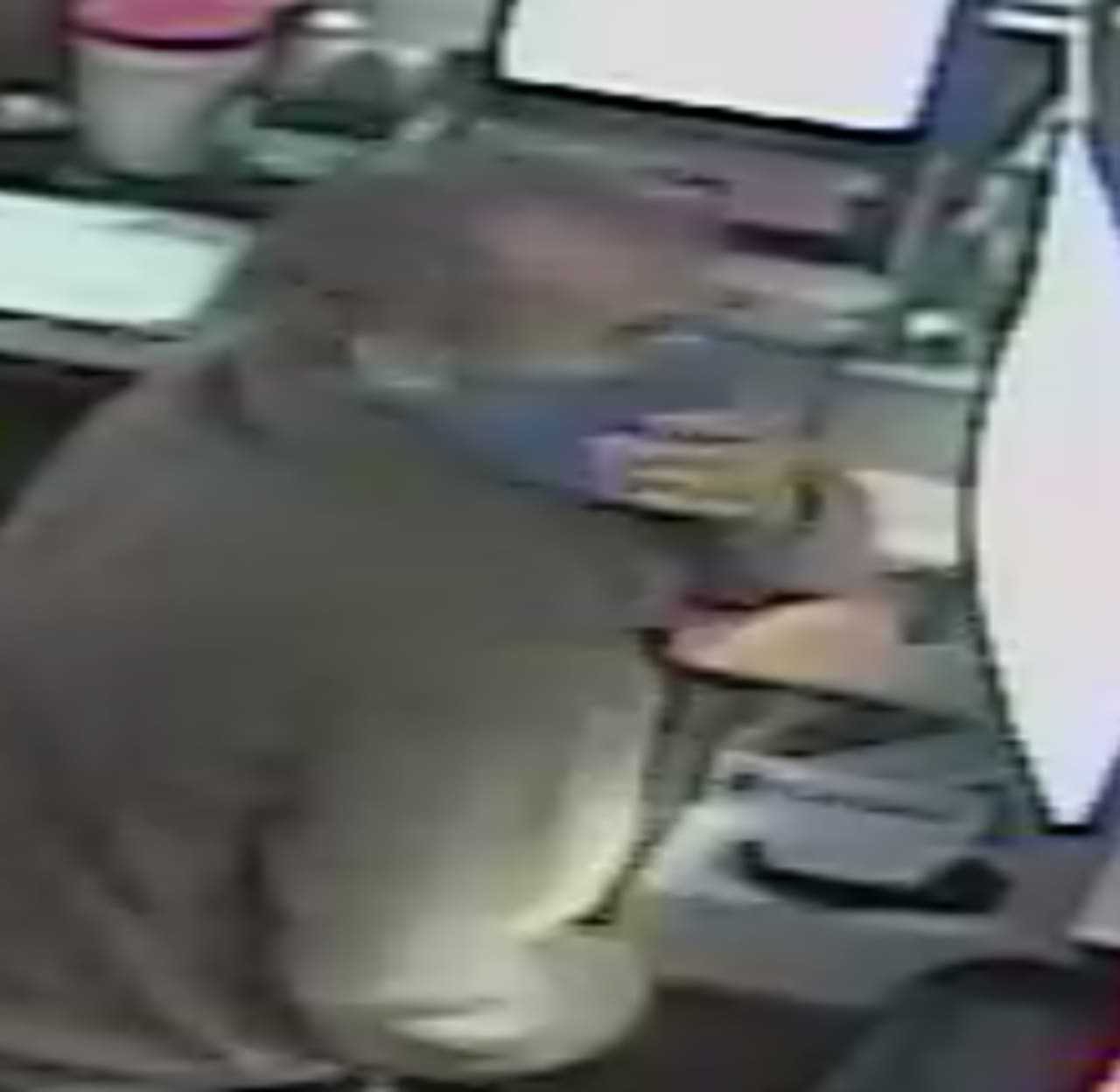 Police investigators in Norwalk have released surveillance photos of the suspect implicated in an alleged robbery.