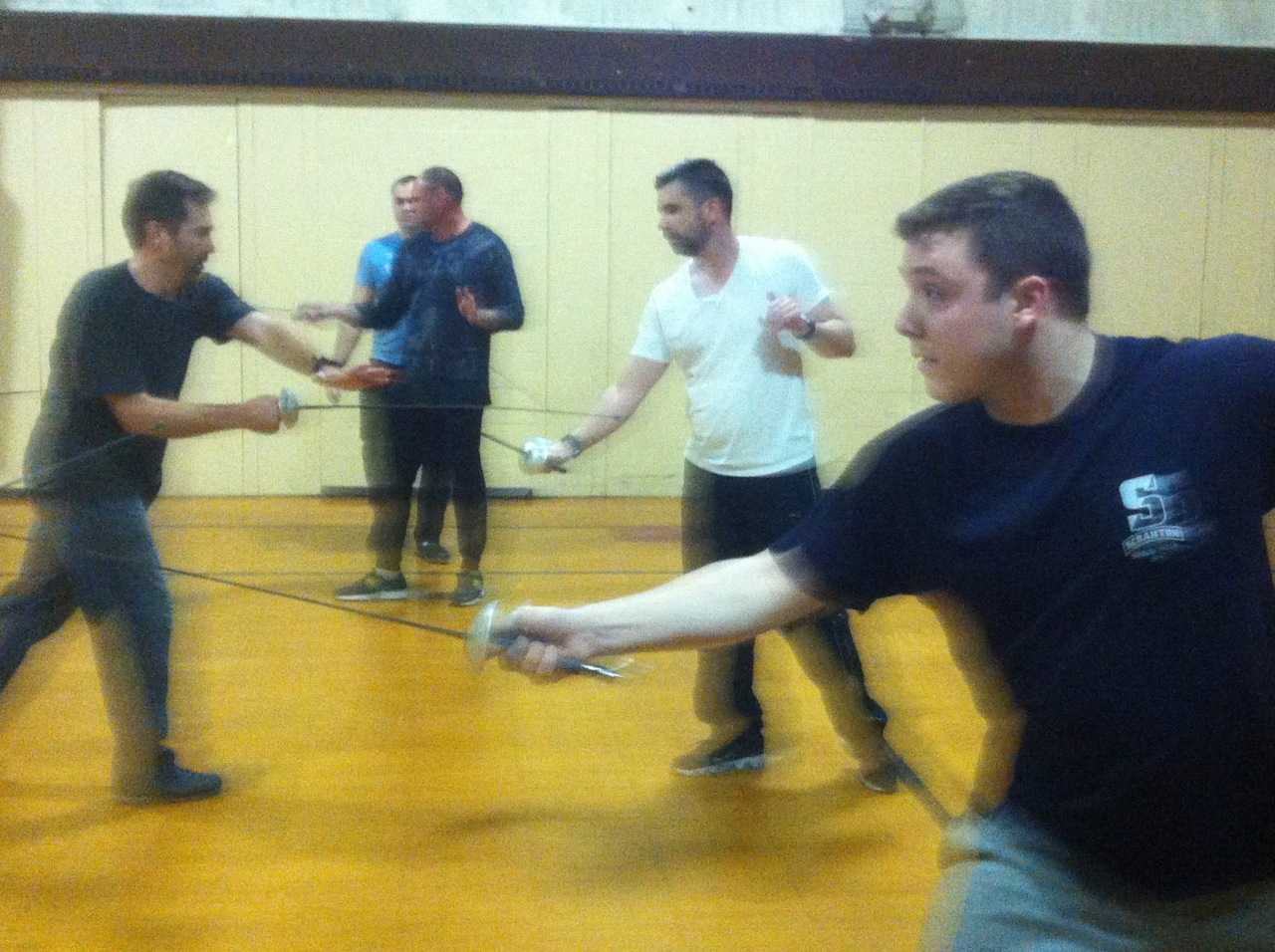 Cast members BJ Kisch, Tim Stalker and Louis Yorey square off at "The Three Musketeers" rehearsal.