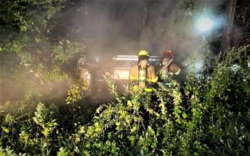 Firefighter Lukas Graf was in his car when he spotted the burning SUV in the woods off Cahill Cross Road around 11:15 p.m. Saturday.