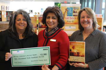 The Wilton Library's Wilton Reads event begins May 18. Pictured: Fairfield County Bank Vice President and Wilton Library trustee Carol Johnson, Wilton Library Executive Director Elaine Tai-Lauria and Karen Danvers, program manager for the library.