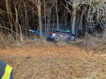Two people were trapped in a single-vehicle crash in Bedford.