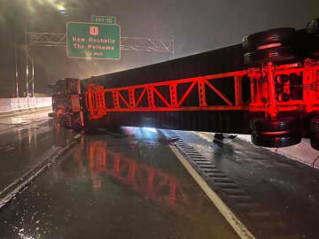 The tractor-trailer blocked all three lanes of traffic on I-95.