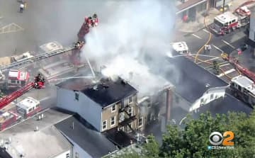 Aerial ladders at work in the Cianci Street fire in Paterson.