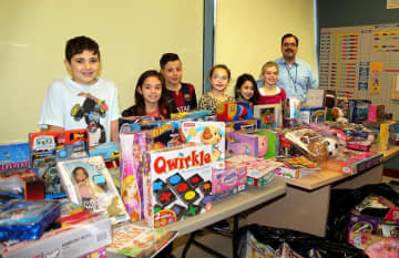 Students, their families and school staff from Columbus Elementary School in Thornwood held a toy drive this month. 