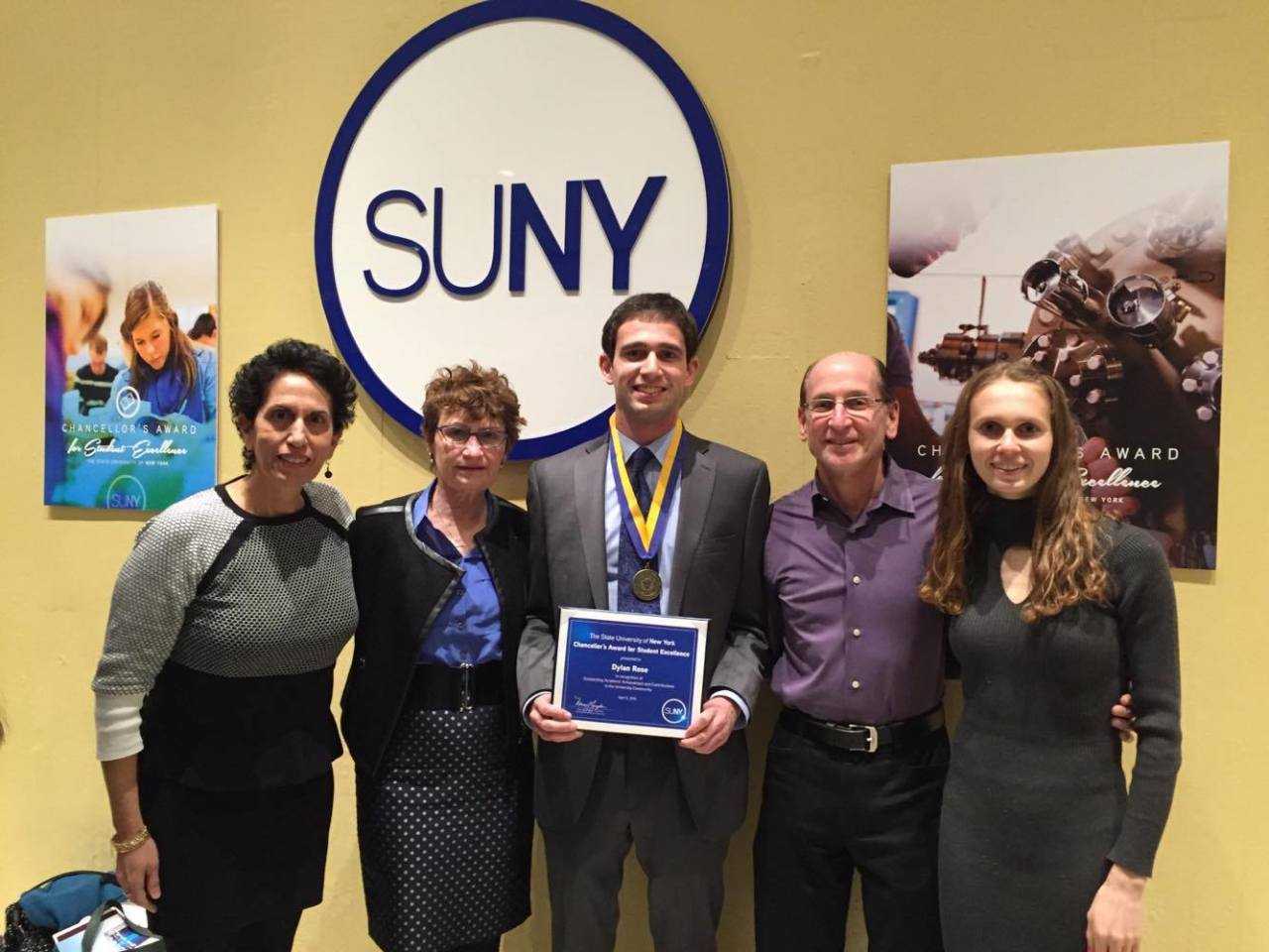 Dylan Rose, center, flanked by Melanie Rose, far left, Director of the New Paltz Honors Program Dr. Patricia Sullivan, Bruce Rose and Chelsea Rose.