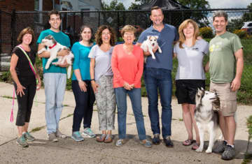 TV celebrity Clinton Kelly of "The Chew" and "What Not to Wear" with volunteers and staff at Pet Rescue in Harrison.