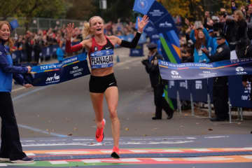 Shalane Flanagan crosses the finish line Sunday morning to win the New York City Marathon. She is the first U.S. woman to win the race in 40 years.