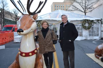 From left, Paula Kelliher, Director of Marketing for The Westchester and White Plains Mayor Tom Roach with new holiday decorations on Court Street in White Plains.