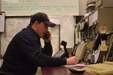 Brendan Sterbinsky, a Teaneck firefighter of five years, calls seniors in the morning to check that they are okay.