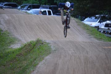 A rider flies on the track at Bethel BMX for Olympic Day.