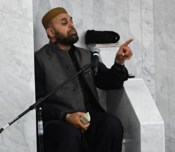Imam Muhammad Tahir delivering a sermon during Friday prayers at Masjid Al-Aisha in Bergenfield.