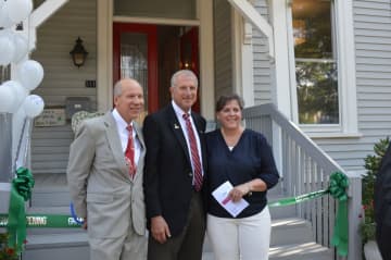 Bill Purcell of the Greater Valley Chamber of Commerce, Shelton Mayor Mark Lauretti and Allison Wysota, founder of Adam's House, opened the Coram Avenue site Thursday.