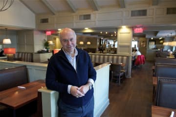 Owner Frank Georgiou poses for a photo at the diner.