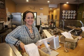 GROW owner Michele Bialek behind the counter.
