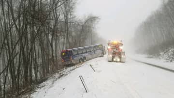 State police ask residents: Stay off roads if you can. If you must go out, reduce speed and give plows plenty of space. The bus crash above is on Route 2 in Marlborough. No passengers were onboard, and injuries were minor, state police said.
