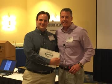 DeCicco & Sons President John DeCicco Jr. is presented with GreenChill Platinum Award by Hillphoenix Vice President of Sales and Marketing Raymond Downes at a recent symposium hosted by Hillphoenix.