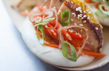 A recipe for asian-inspired steamed buns won a $10,000 scholarship for two Culinary Institute of America students.