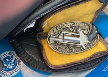 The belt-buckle gun could quickly be popped out of its “decorative metal oval frame” and used, the TSA said.