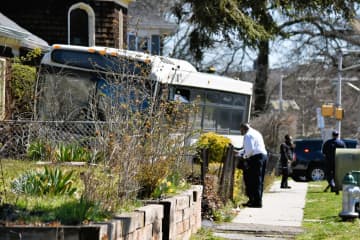 The crash knocked an NJ TRANSIT bus onto a resident's law during a police pursuit in East Orange on Sunday, March 26.