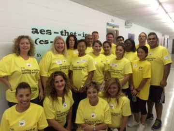 Ernst & Young visited A.S. Faust School in East Rutherford to refresh the paint in the hallways, as well as paint a wall mural.