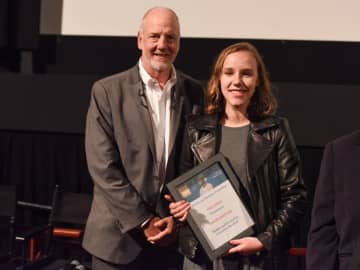 Francesa Murdoch receiving an award at the Mental Health Film Festival