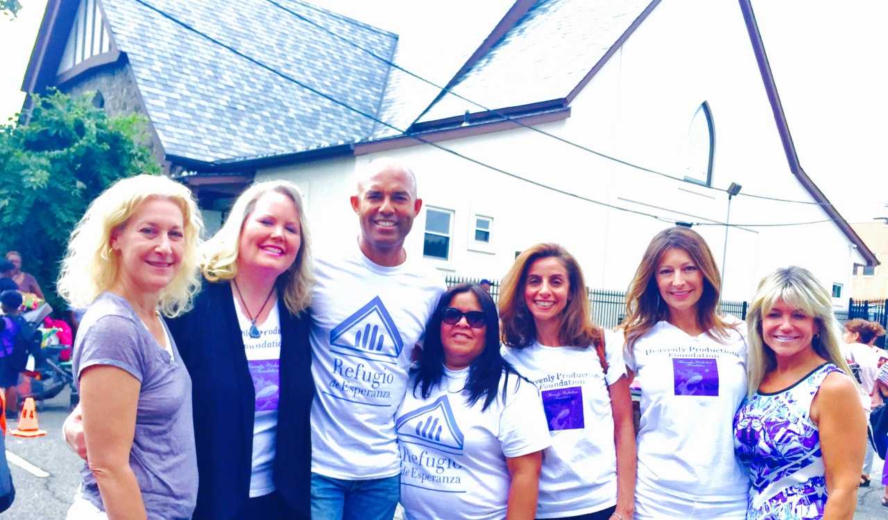 Mariano Rivera and his wife, Pastor Clara Rivera, third and fourth from left, helped distribute backpacks with school supplies to children in need at Refuge of Hope Church in New Rochelle.